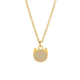 Gold necklace with a buff colored cat-shaped enamel charm pendant on a white background