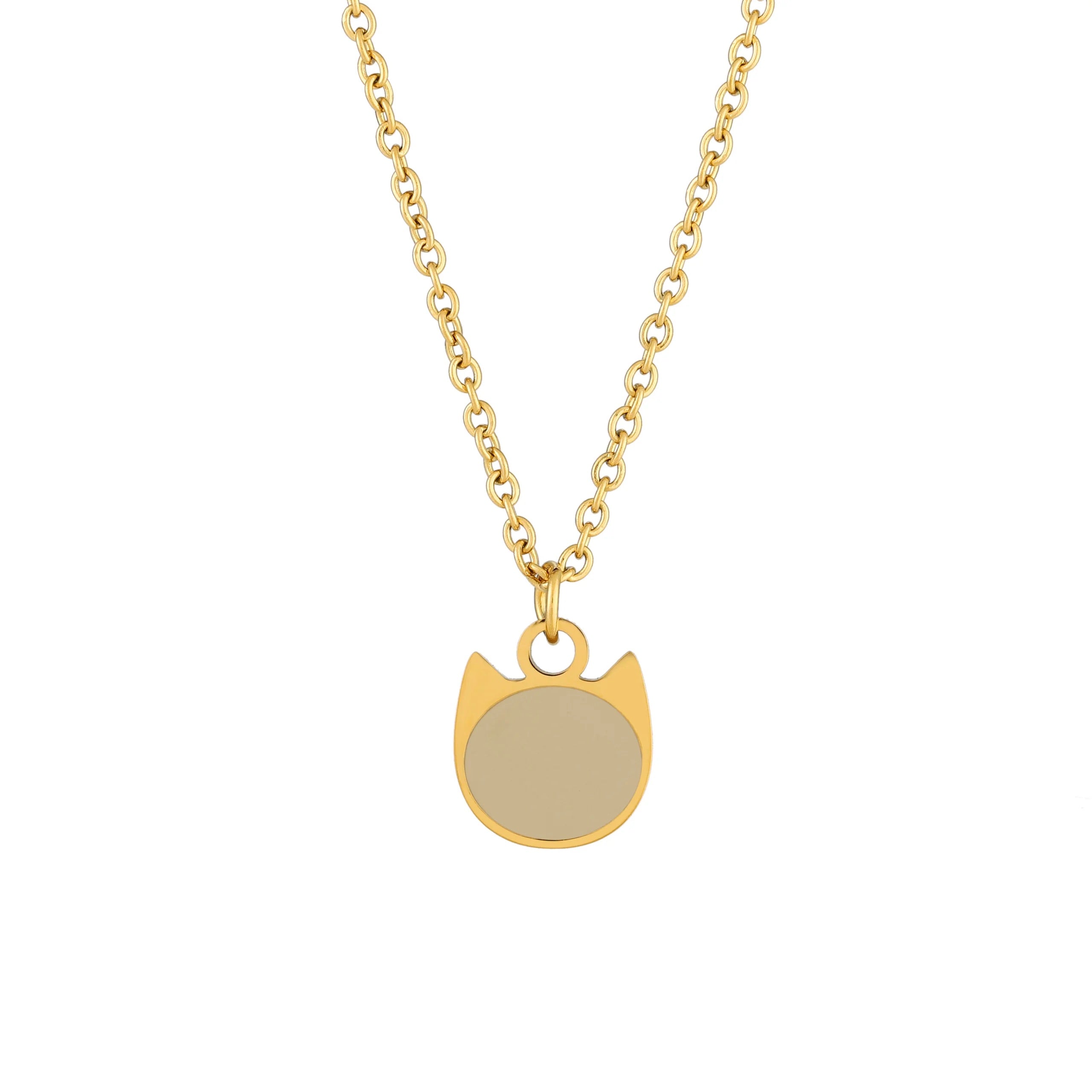 Gold necklace with a buff colored cat-shaped enamel charm pendant on a white background
