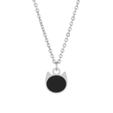 A silver chain necklace with a cat-shaped pendant featuring a solid black circular center, shown against a plain white background.