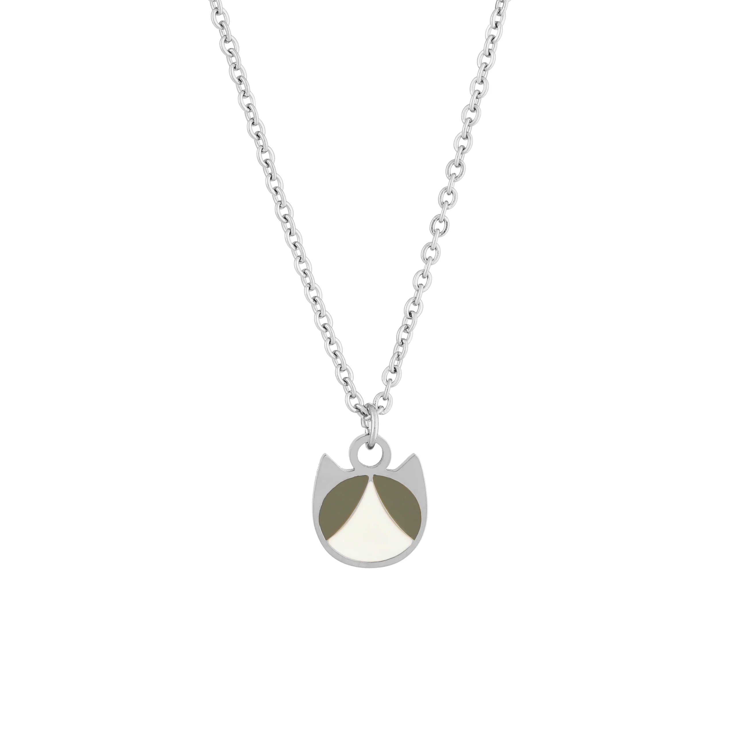 A silver chain necklace with a minimalist pendant shaped like a cat's face, featuring a silver border and two colored sections: one in dark grey and one in cream white.