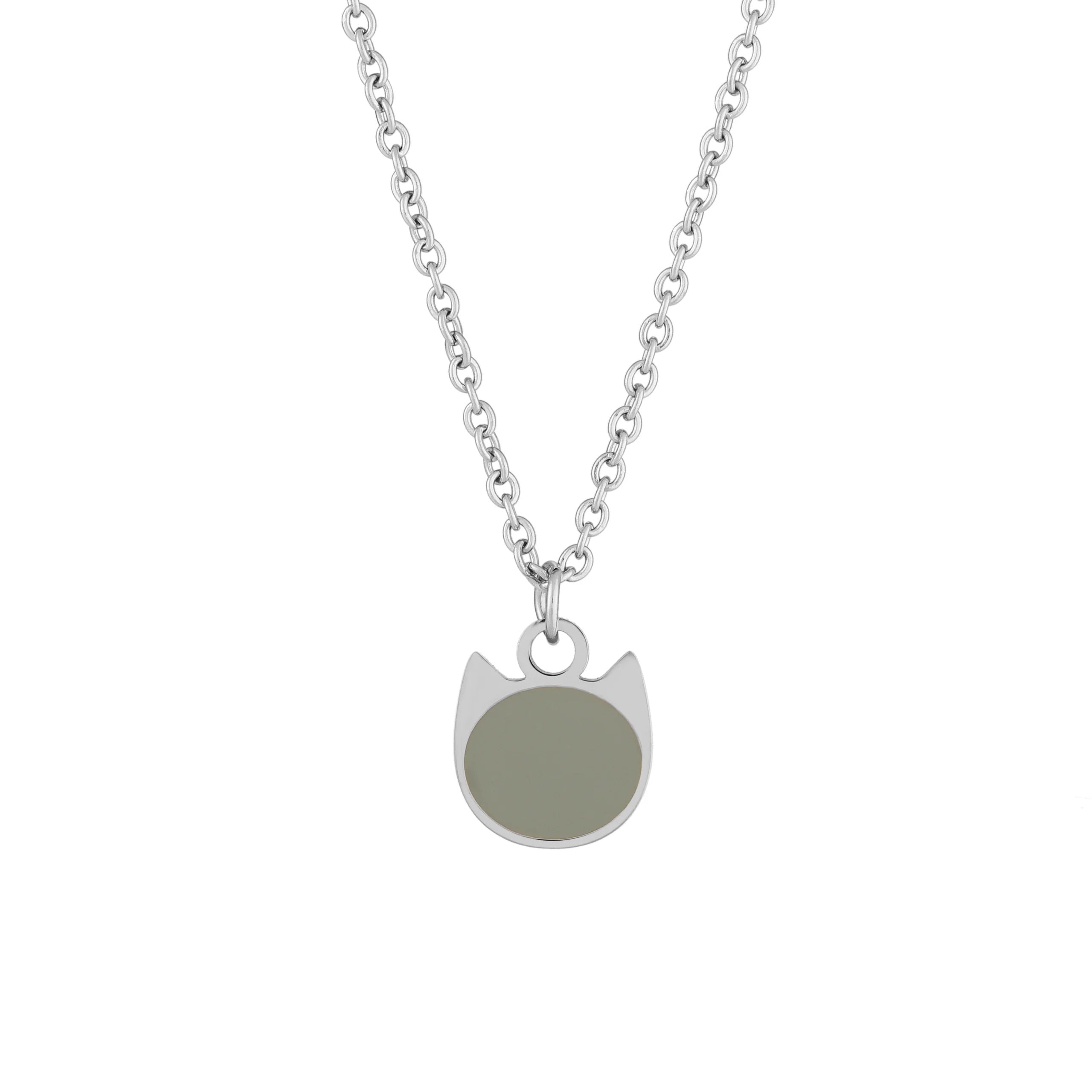 A silver chain necklace with a minimalist pendant shaped like a cat head, featuring a solid sage green circular face, shown against a plain white background.