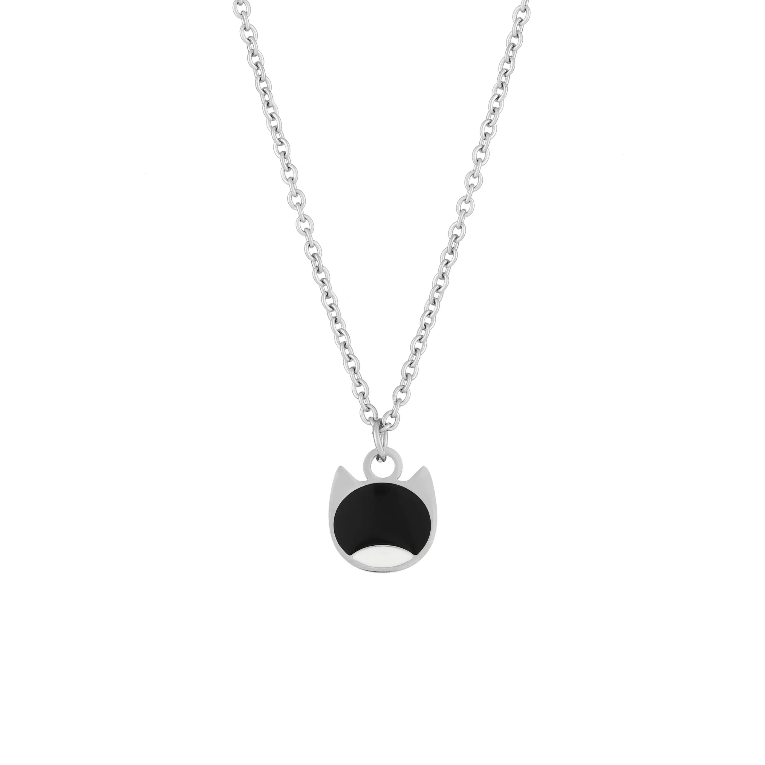 A silver chain necklace with a pendant shaped like a cat face, featuring a black enamel fill on the upper half and a silver outline on the lower half, shown against a plain white background.