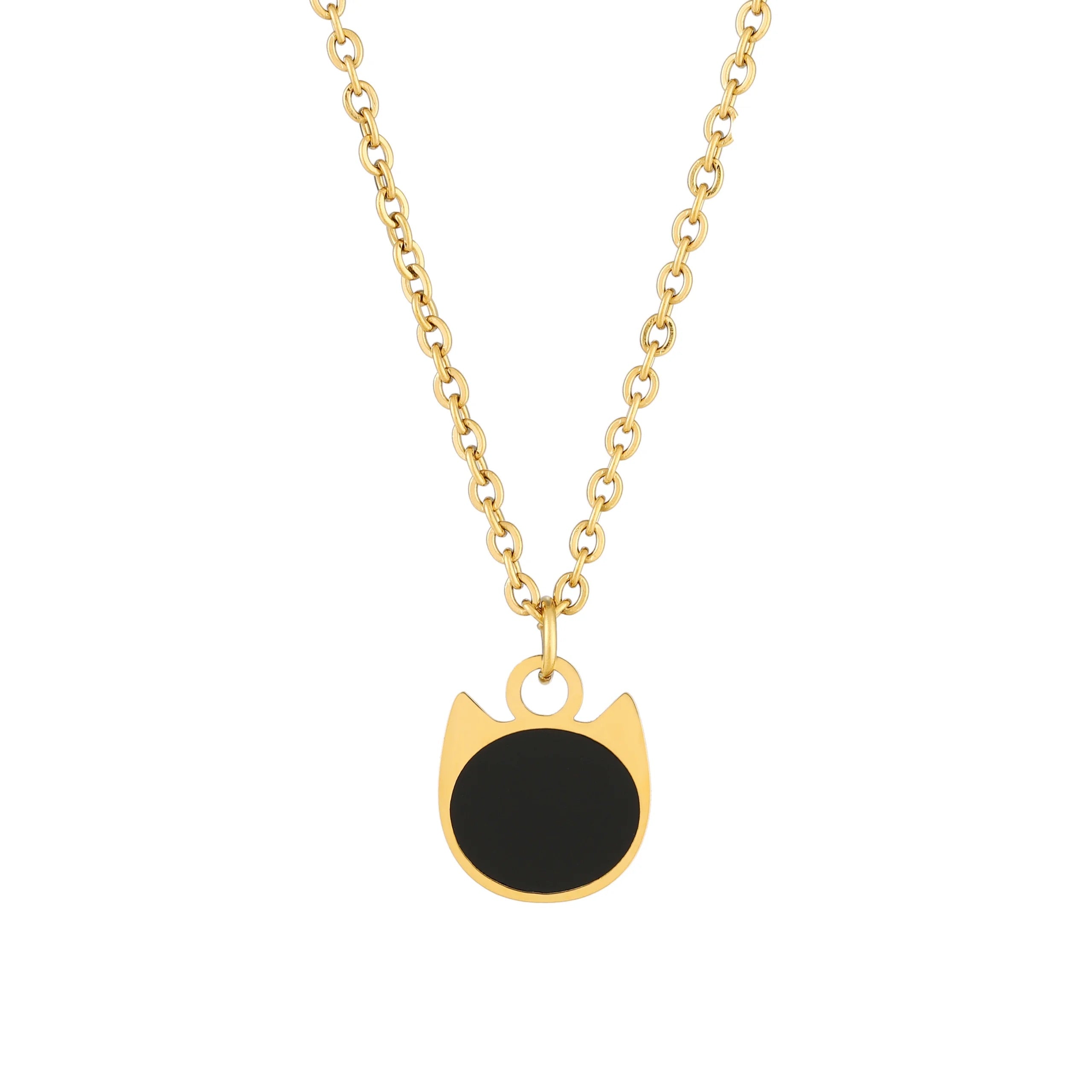 A gold chain necklace with a pendant shaped like a cat's head, featuring a solid black circular center and a polished gold border, shown against a plain white background.