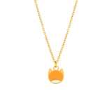 A gold chain necklace with a small pendant shaped like a cat's face, featuring a bright orange enamel fill and a white accent at the bottom, shown on a plain white background.