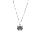 A silver chain necklace featuring a minimalist pendant shaped like a cat's face, with a dark gray top half and a white bottom half, shown against a plain white background.