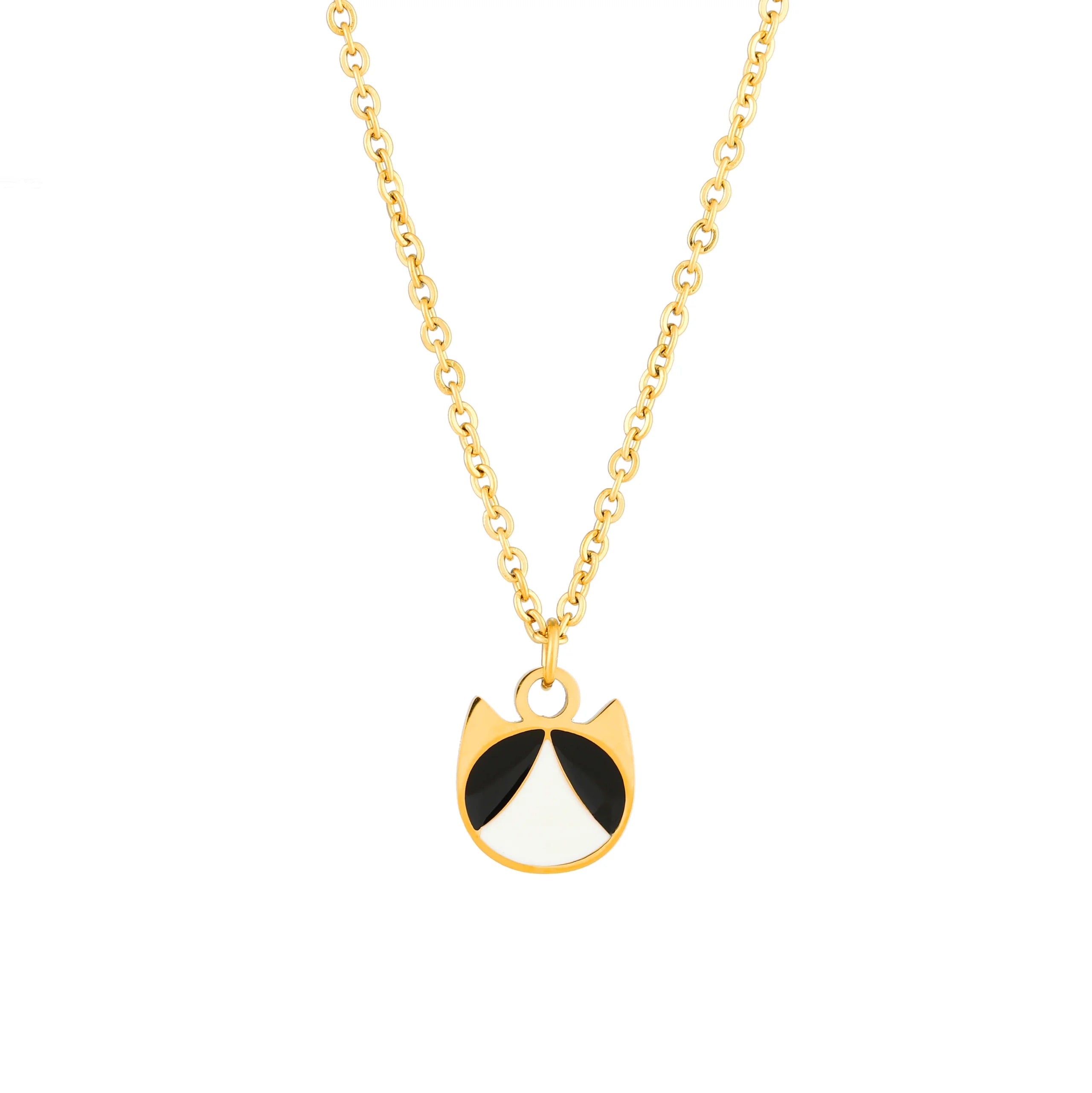 A gold chain necklace featuring a small pendant shaped like a cat face, with black and white enamel details, shown against a plain white background.