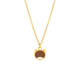 A gold chain necklace with a small pendant shaped like a cat face, featuring a brown center and white lower half, shown on a plain white background.