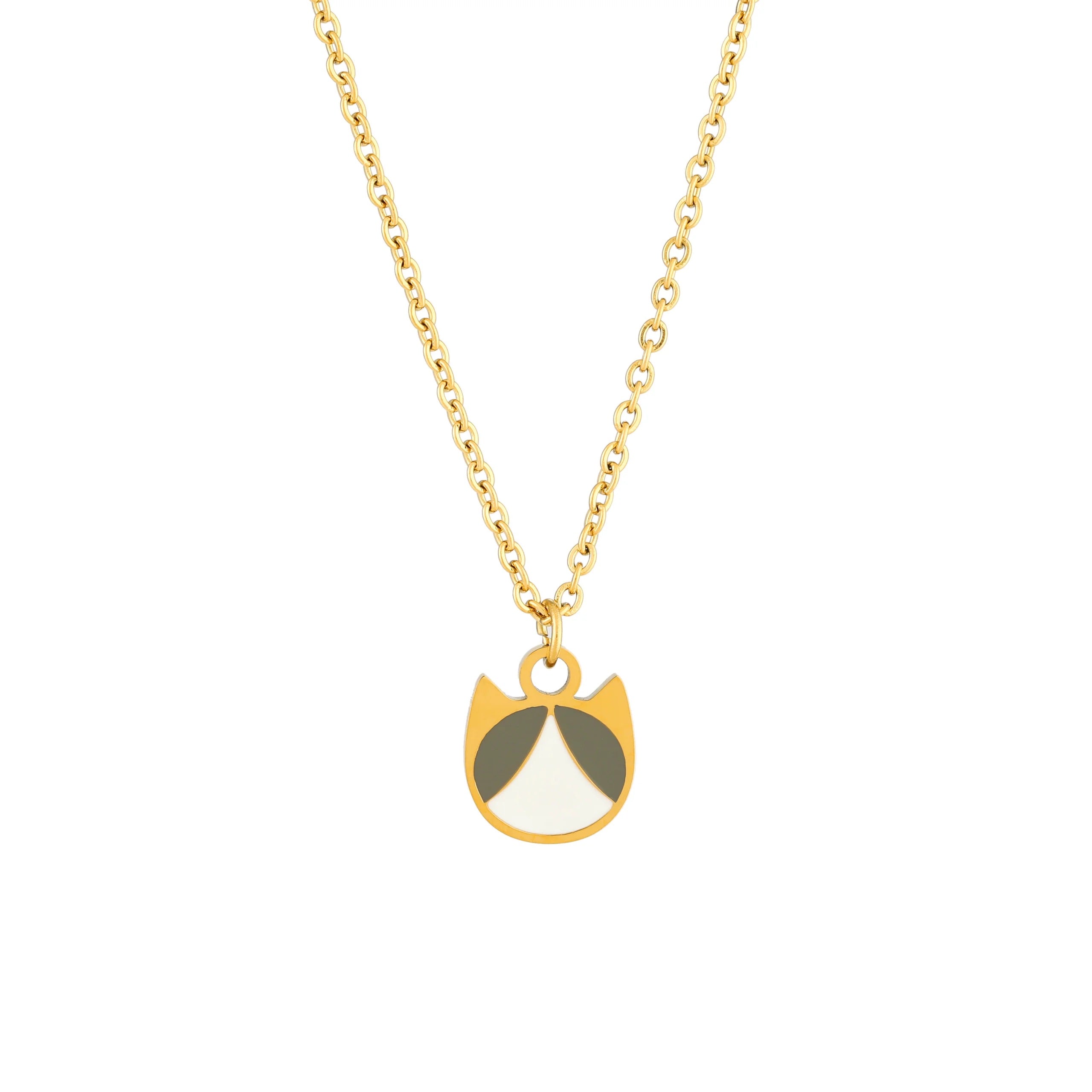 A gold chain necklace with a minimalist cat-shaped pendant featuring gold, white, and gray enamel details, shown against a plain white background.