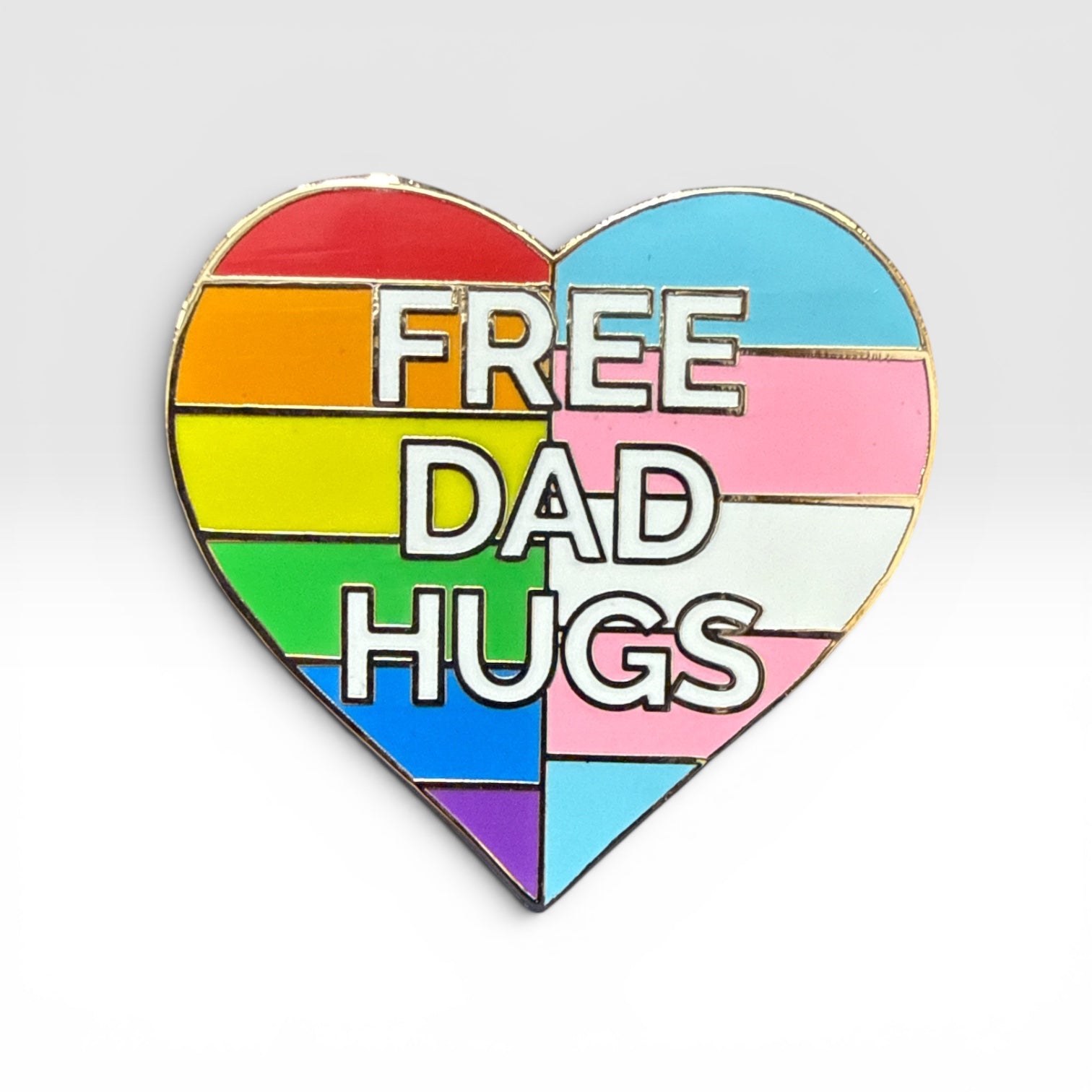 Heart-shaped rainbow pin with 'FREE DAD HUGS' text on a white background