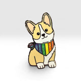 A cartoon-style corgi-shaped pin with a rainbow bandana and small striped bow, shown on a clean light gray background.