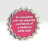 A starburst-shaped enamel pin with a glittery pink center, white text reading 'Do everything with the unearned confidence of a mediocre white man!', and white and gold metallic borders, shown on a light gray background.