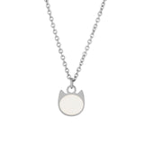 A silver-toned necklace featuring a minimalist pendant shaped like a cat's head with a smooth, circular off-white face, displayed against a solid white background.