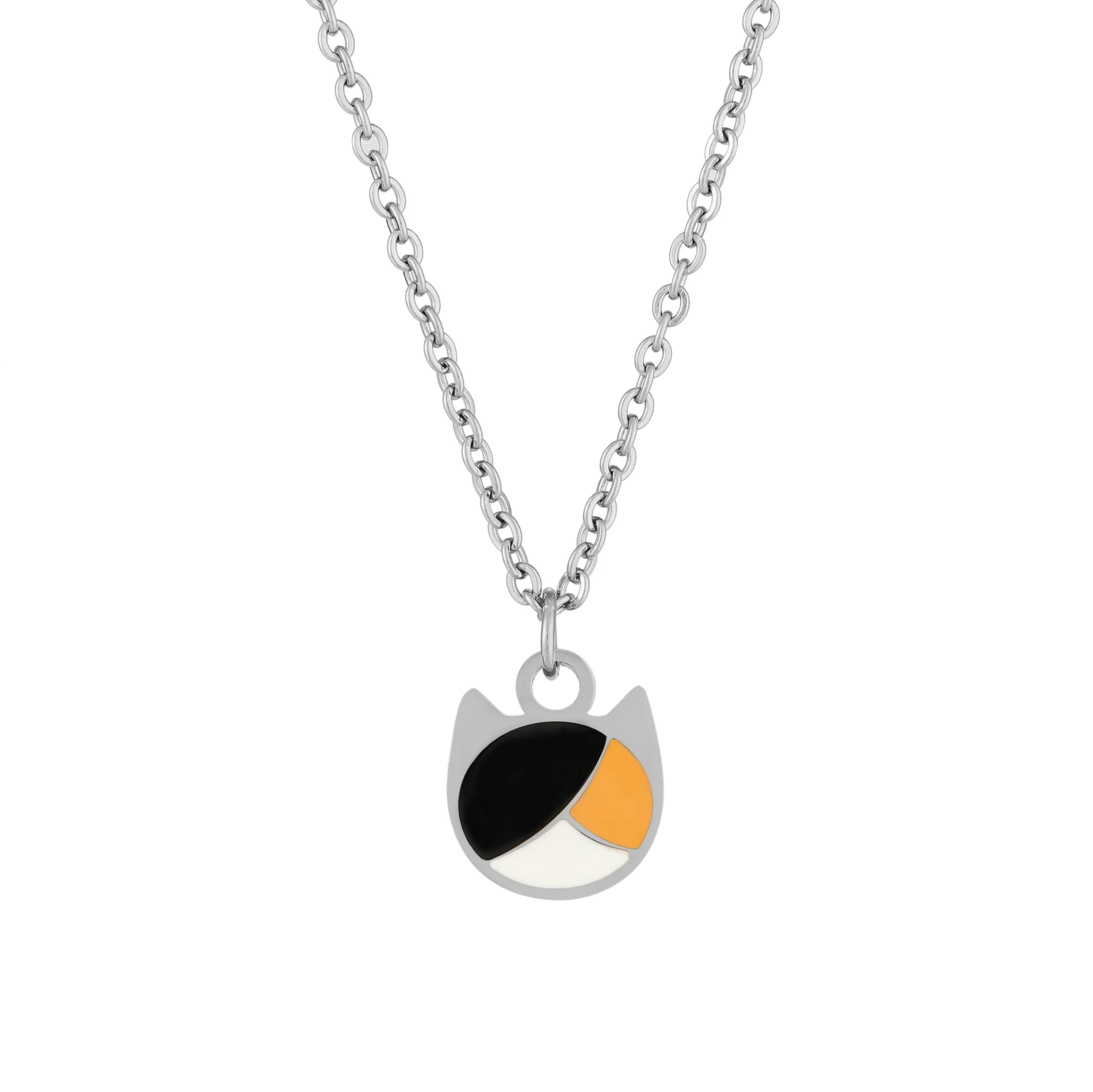 A silver chain necklace with a pendant shaped like a cat head, featuring black, white, and orange color-blocked details on a clean white background.