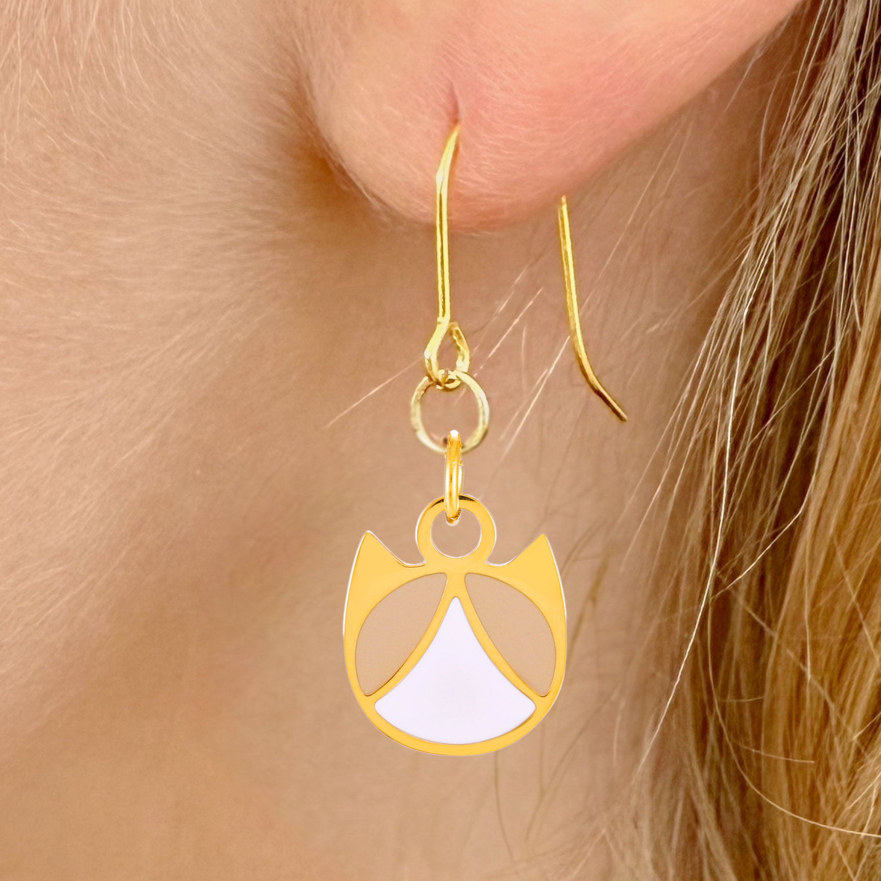 Tuxedo minimalist cat earrings in silver or gold with a black and white tuxedo cat silhouette charm