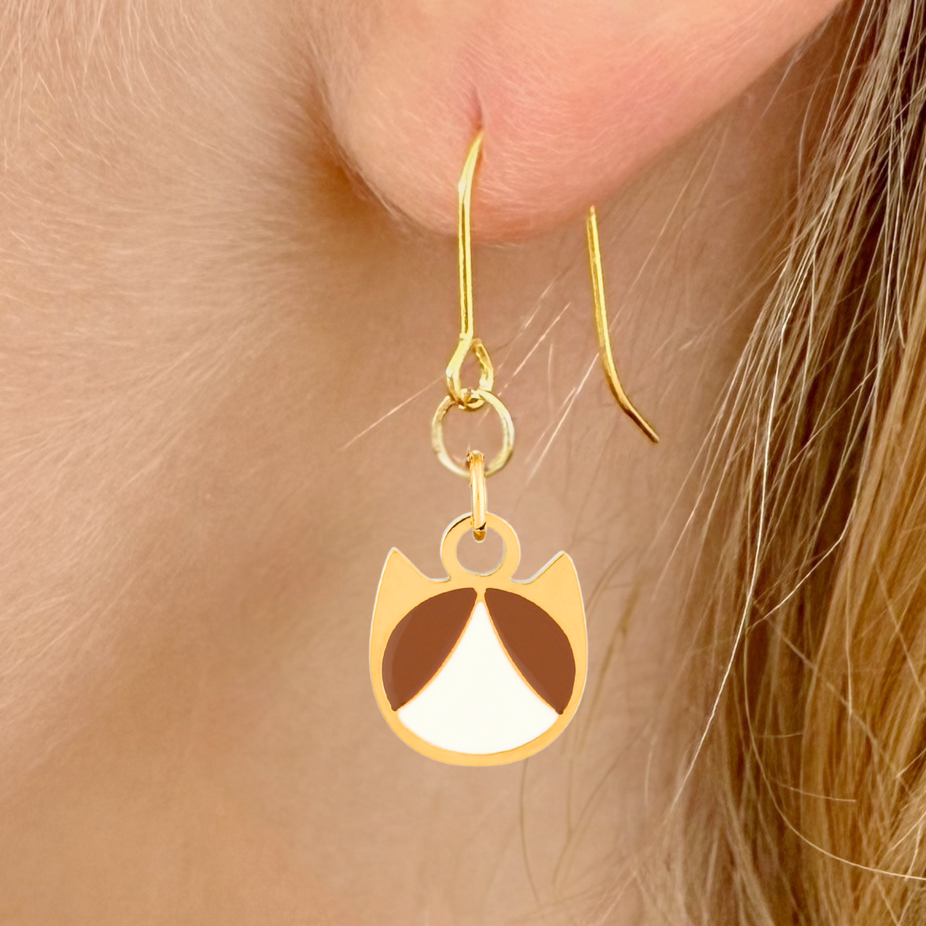 Tuxedo minimalist cat earrings in silver or gold with a black and white tuxedo cat silhouette charm