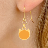 Solid minimalist cat earrings in silver or gold with a solid-color cat silhouette charm