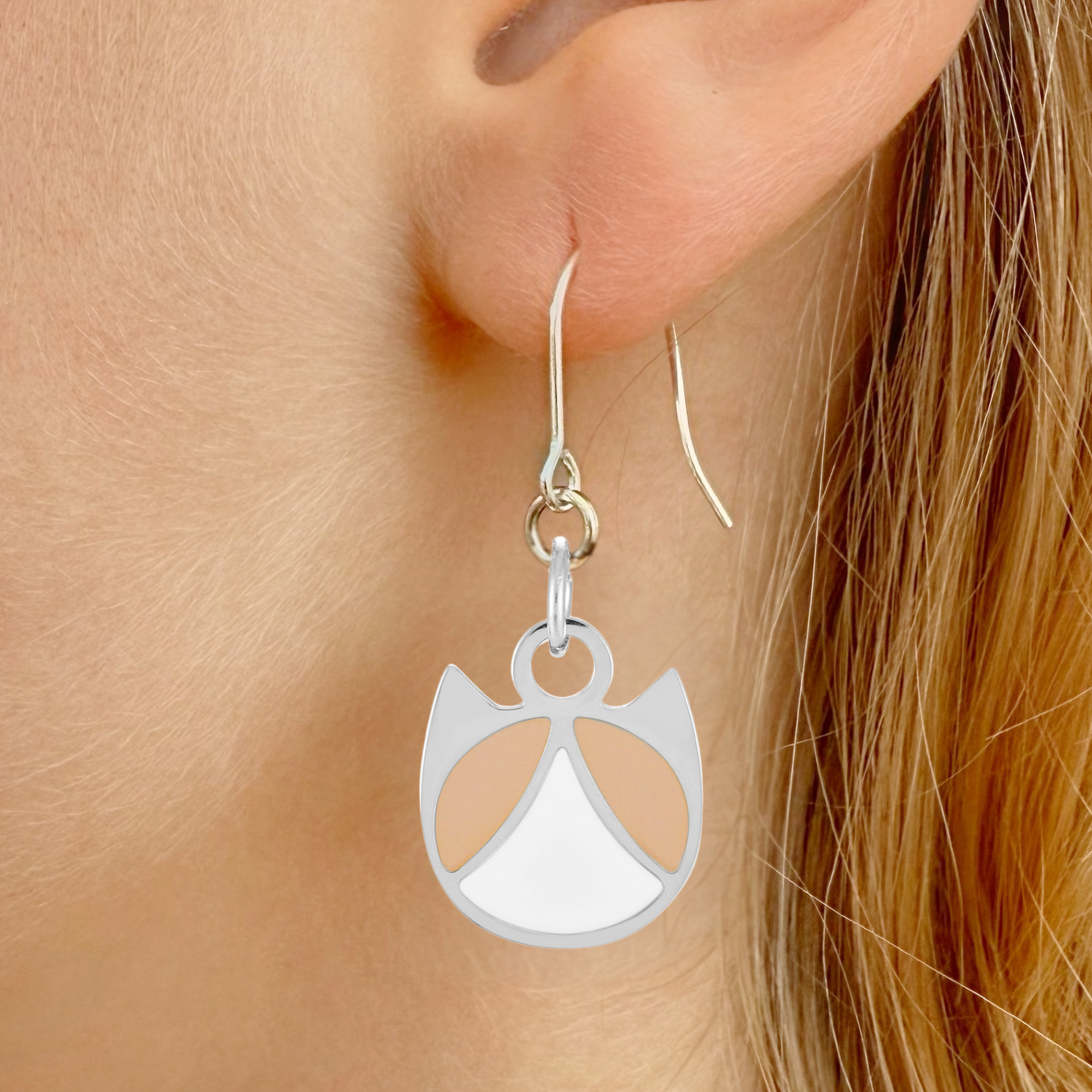 Tuxedo minimalist cat earrings in silver or gold with a black and white tuxedo cat silhouette charm