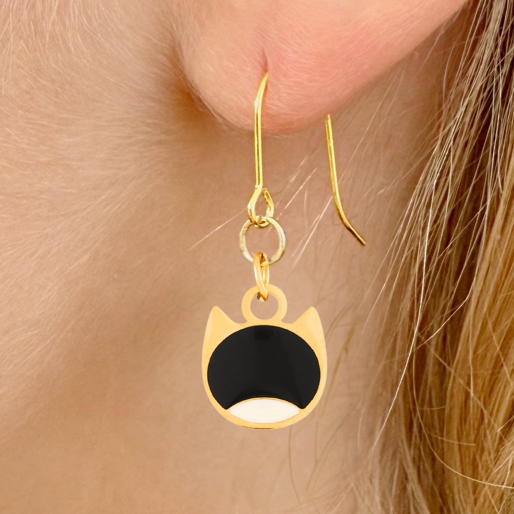 Bi-color minimalist cat earrings in silver or gold with a two-tone cat silhouette charm