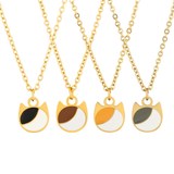 Asymmetrical minimalist cat charm necklace in silver or gold with an asymmetrical two-tone cat silhouette charm