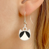 Tuxedo minimalist cat earrings in silver or gold with a black and white tuxedo cat silhouette charm