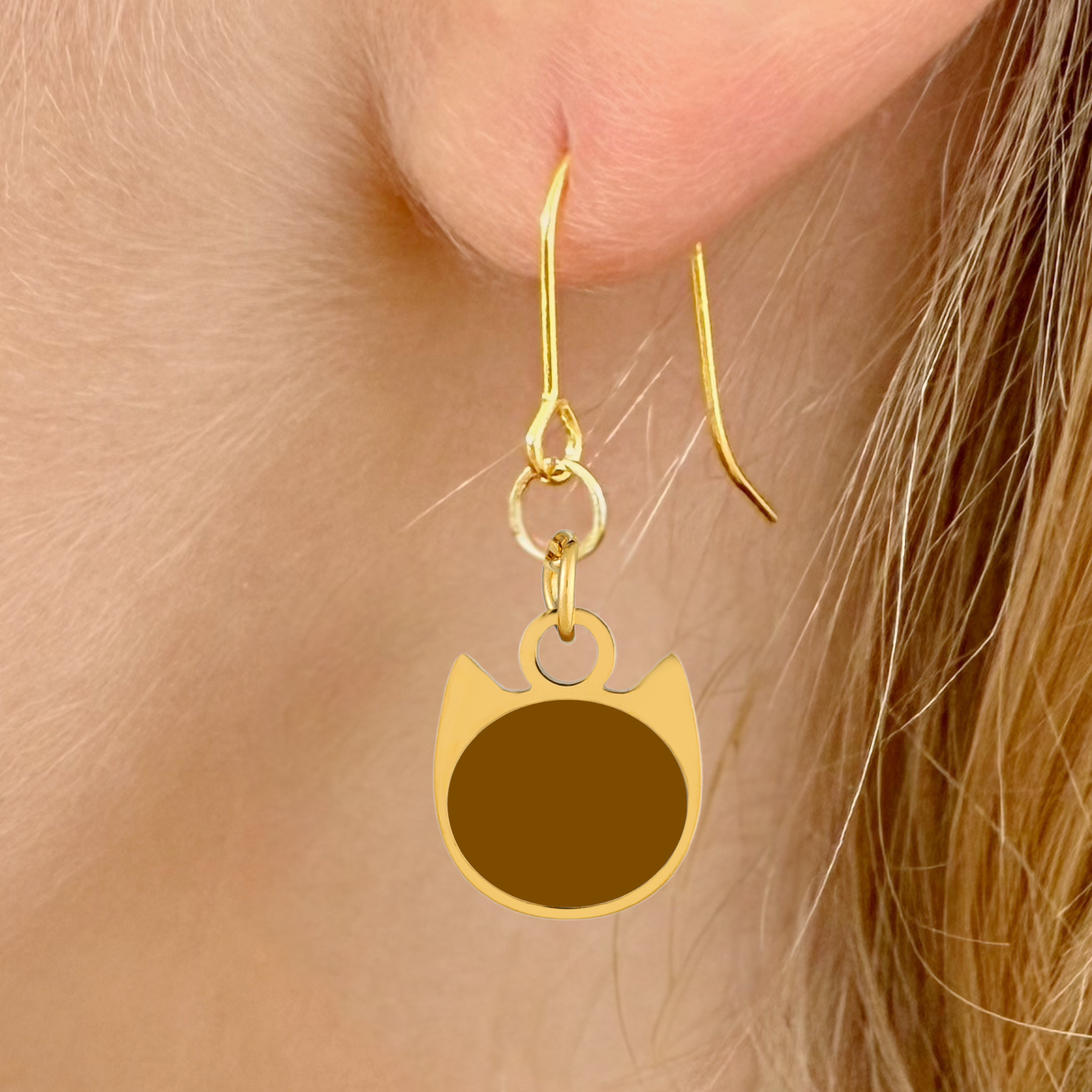 Solid minimalist cat earrings in silver or gold with a solid-color cat silhouette charm
