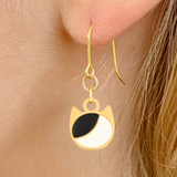 Asymmetrical minimalist cat earrings in silver or gold with an asymmetrical two-tone cat silhouette charm