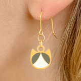 Tuxedo minimalist cat earrings in silver or gold with a black and white tuxedo cat silhouette charm
