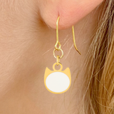 Solid minimalist cat earrings in silver or gold with a solid-color cat silhouette charm