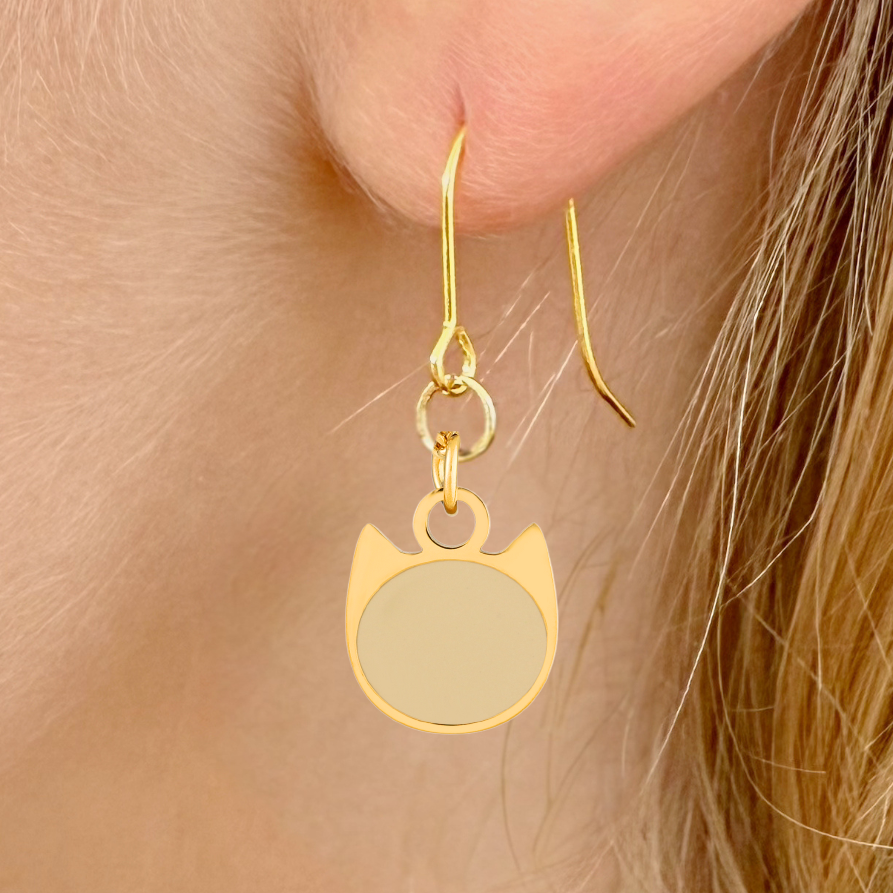 Solid minimalist cat earrings in silver or gold with a solid-color cat silhouette charm