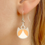Tuxedo minimalist cat earrings in silver or gold with a black and white tuxedo cat silhouette charm