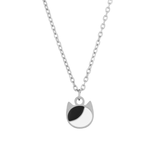 Asymmetrical minimalist cat charm necklace in silver or gold with an asymmetrical two-tone cat silhouette charm