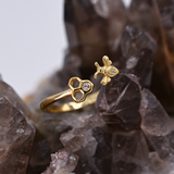 Adjustable bee and honeycomb ring in silver or gold with a bee charm and two CZ stones