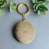 Be Kind & Stay Weird enamel keychain with hand-lettered text in gold plating