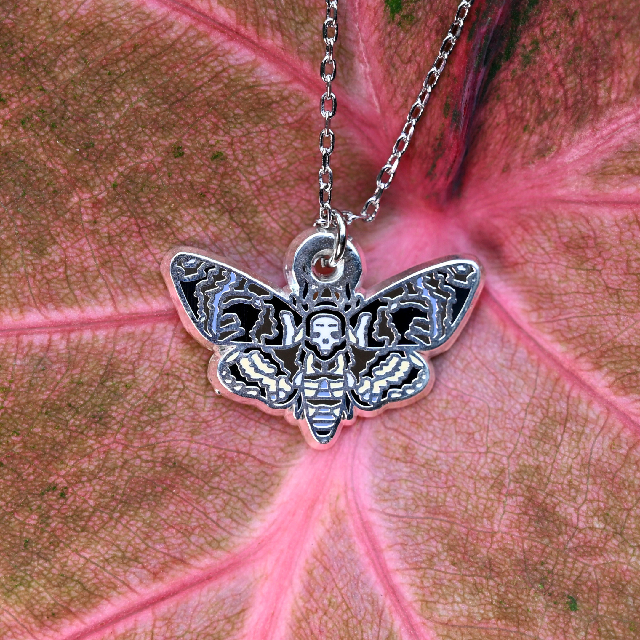Death's-head hawkmoth necklace in silver or gold with a hawkmoth silhouette charm with the skull marking