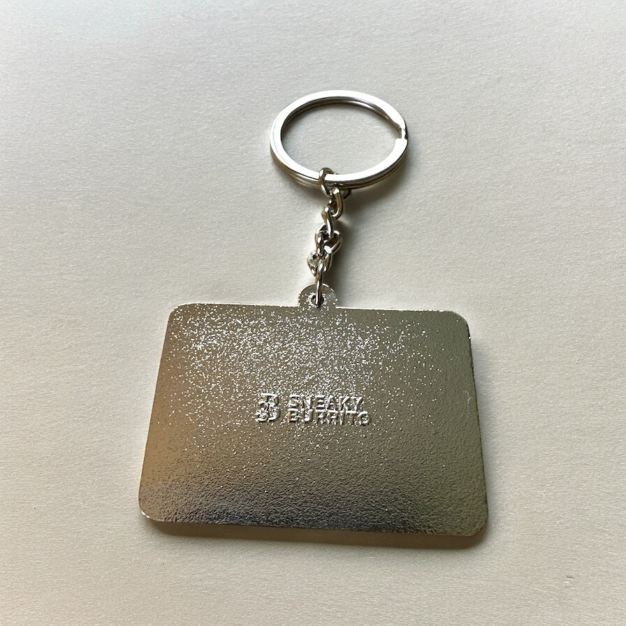 Hello I'm Trying My Best enamel keychain designed as a name tag in red and white