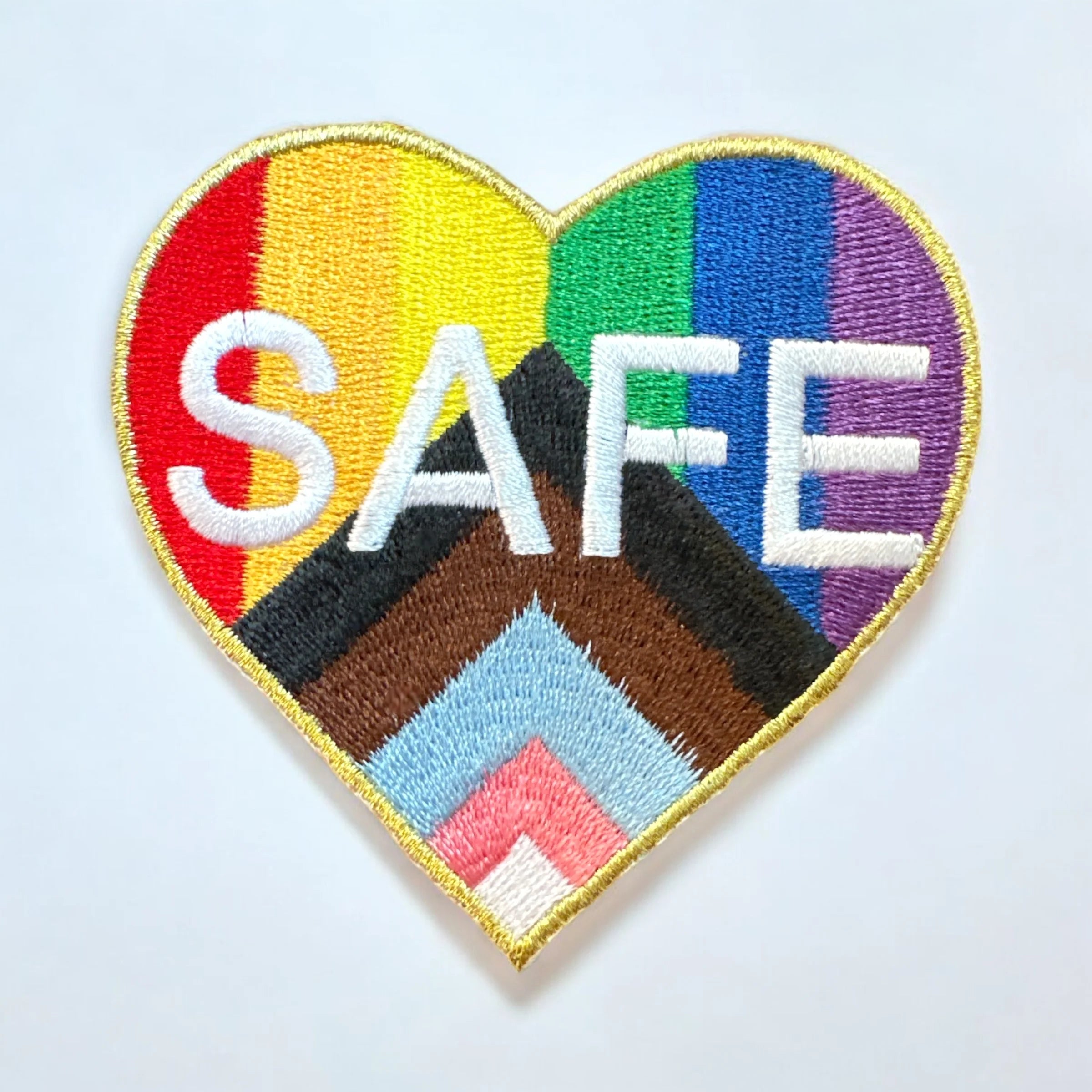 Embroidered rainbow patch with the word SAFE